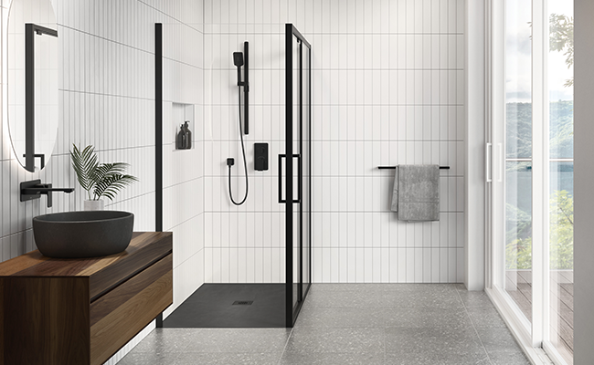 A shower space with black Kalia faucets.